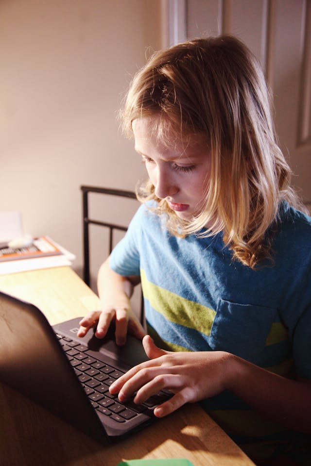 How to Remove Chromebook Management ? 2 Child using a laptop computer for online learning at home