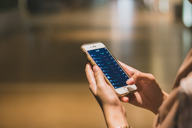 Apple Pay Pending - Explained 5 Person checking finance app on smartphone portfolio and market stats on mobile