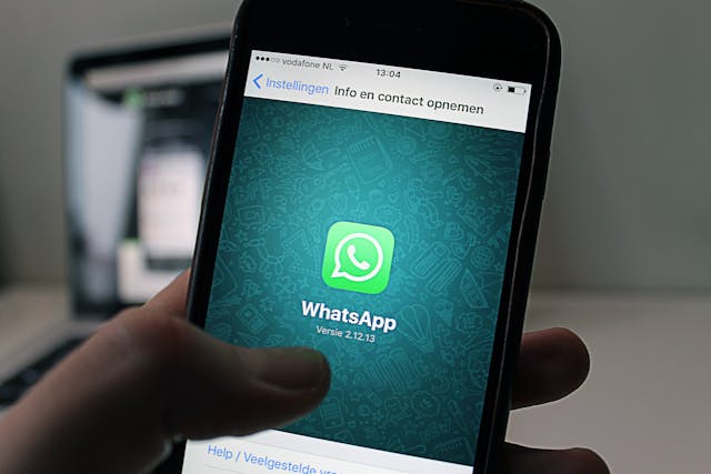 How To Find Hidden Messages On iPhone 4 iPhone displaying WhatsApp app install screen close-up
