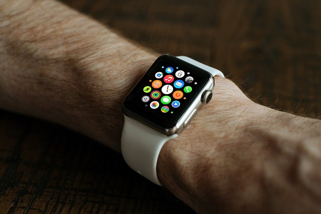 Apple Watch Not Charging Red Lightning Bolt 2 Apple Watch with white sport band showing app grid on wrist.