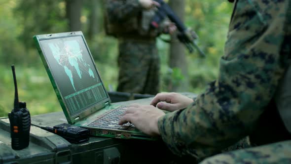 Military Operation in Action, Soldiers Using Military Grade Laptop ...