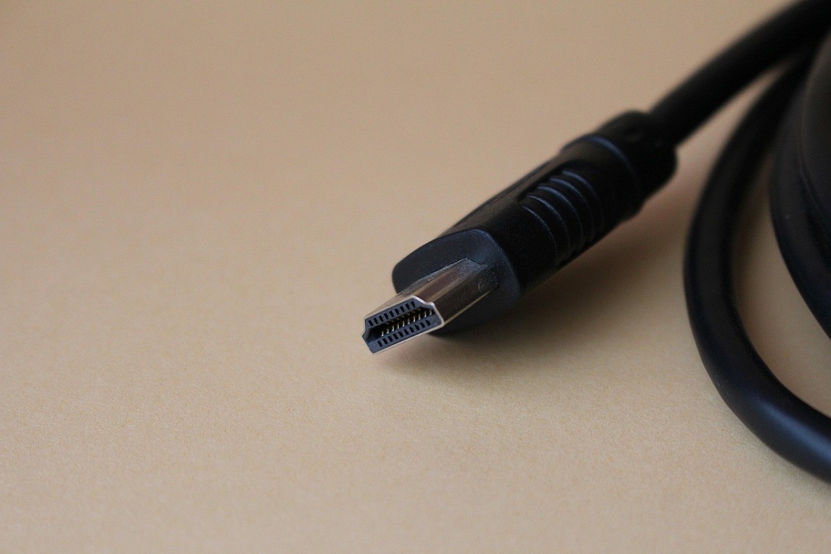 Closeup of an HDMI cable resting on a surface.