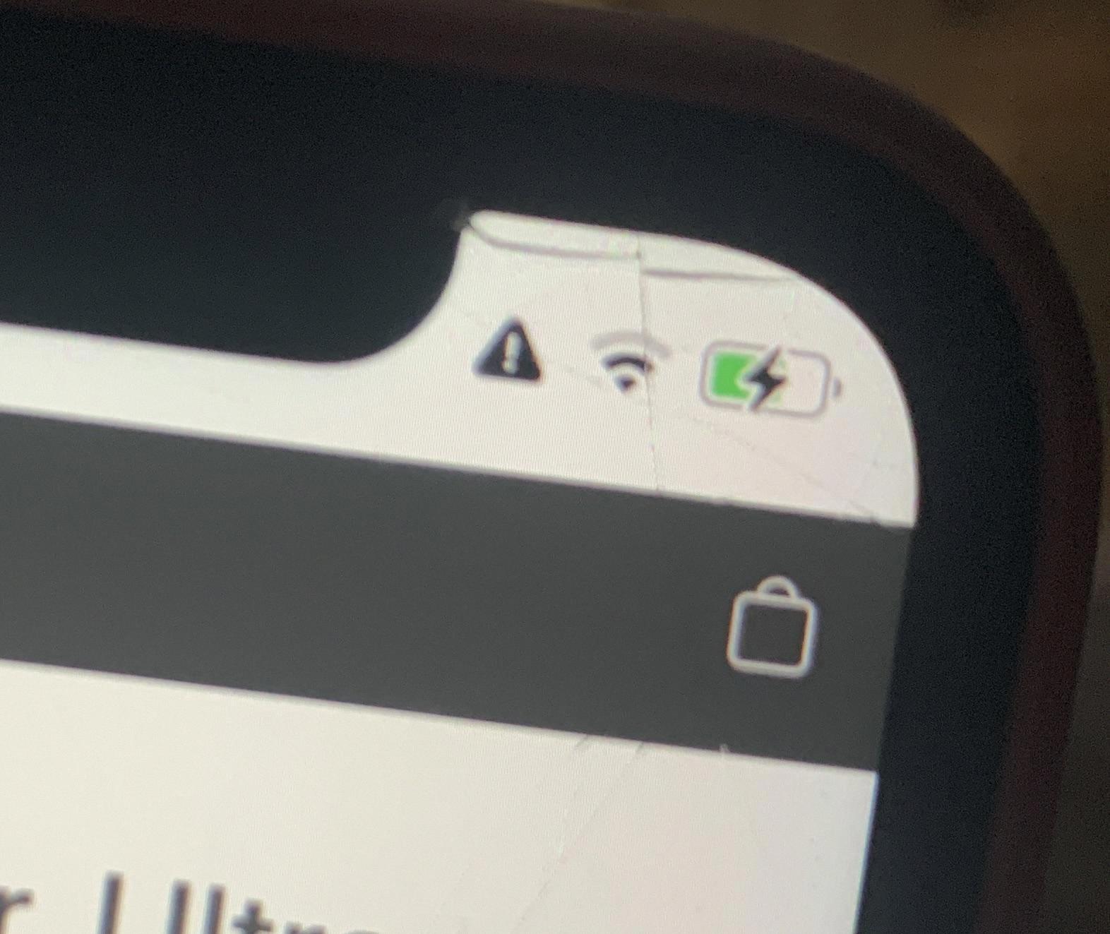 what does a triangle with exclamation mark mean on android